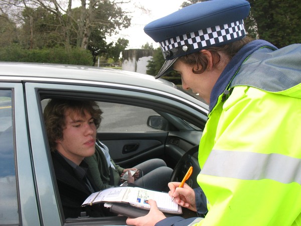 Police Constable Ciara Allerton commends driver Christopher Swney and passenger for both wearing their safety belts.   